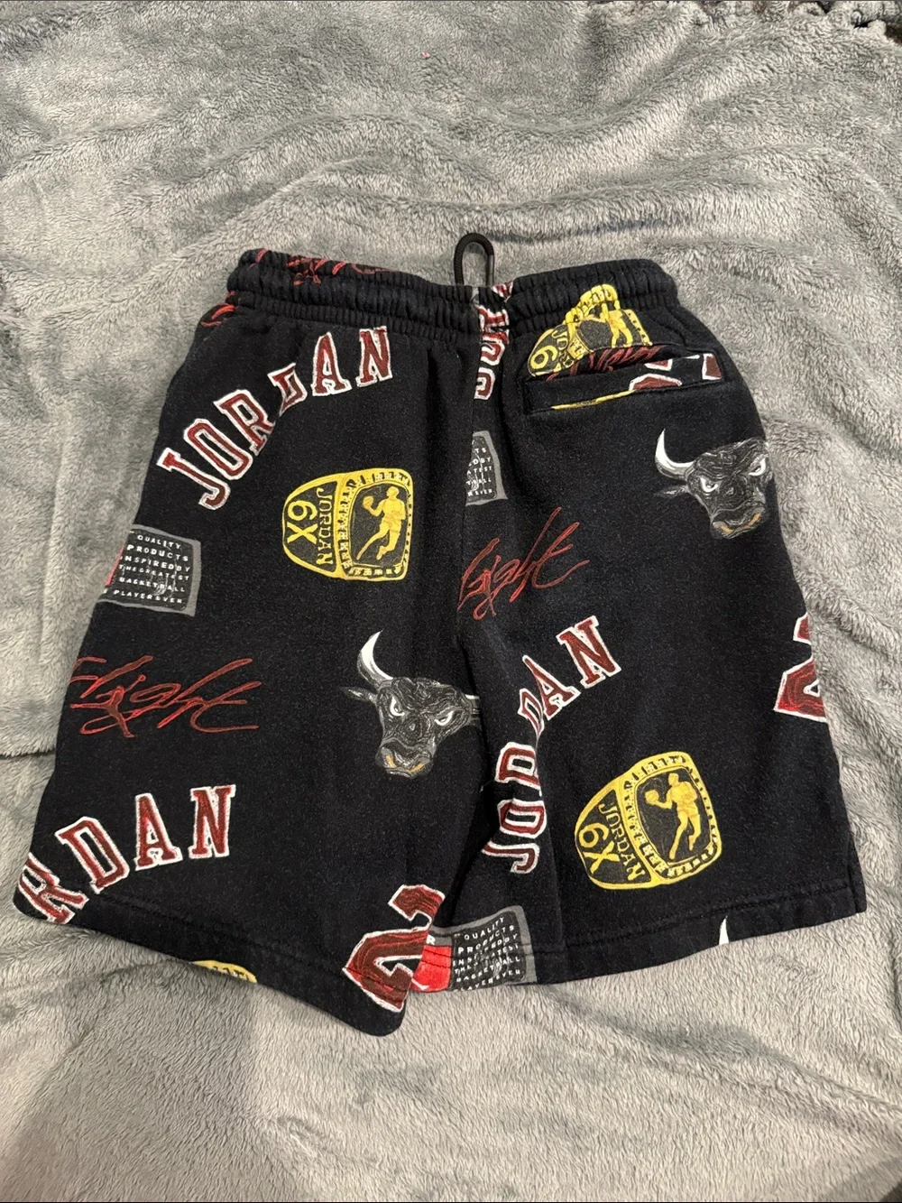 Jordan Black Graphic Logo Athletic Shorts with Red & Yellow Accents